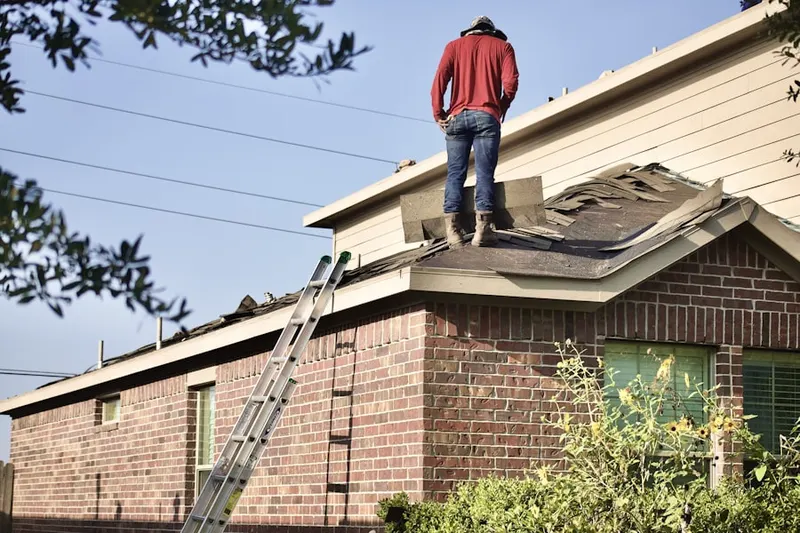 Professional roofer working on a residential roof in Stovertown